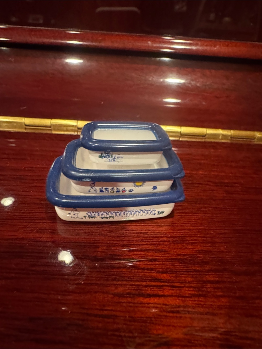 Stackable Ceramic Nesting Dishes with Blue Rim doll house